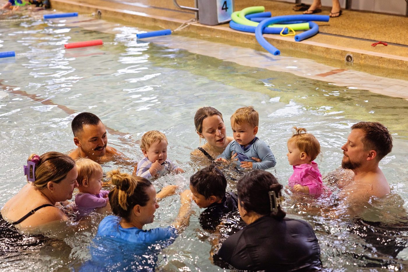 Parents and babies together in the pool