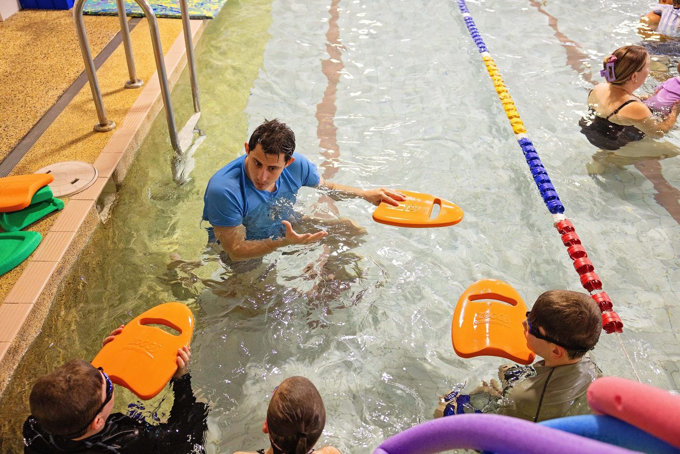 Swimmer training in a lane